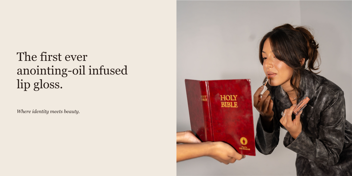 Gabriella applying Liberté lip gloss while looking into a Bible held like a mirror